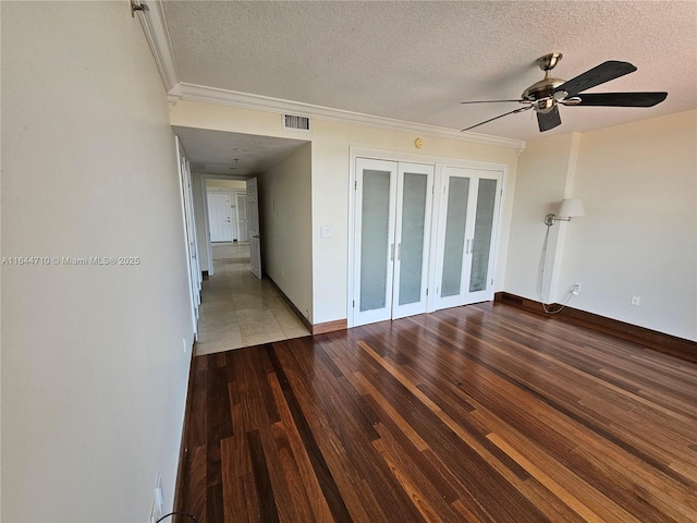 1650 Coral Way Unit 601, Miami, FL 33145 - spare room featuring french doors, a textured ceiling, ceiling fan, wood finished floors, and ornamental molding