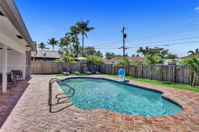 view of swimming pool featuring a patio