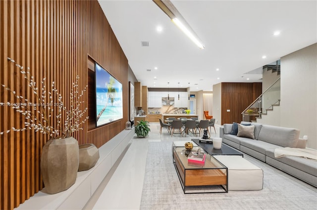 living room featuring wooden walls