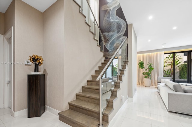 stairway featuring tile patterned floors