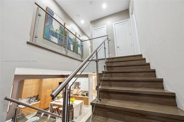 staircase featuring hardwood / wood-style flooring