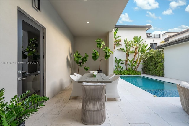 view of swimming pool with a patio area