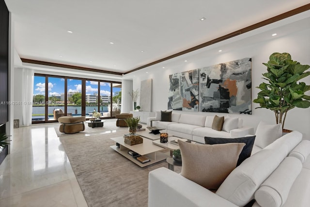 living room featuring expansive windows and a water view