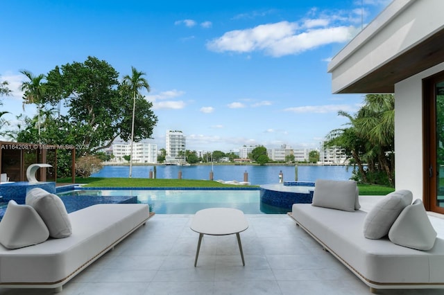 view of swimming pool with an in ground hot tub, an outdoor living space, a water view, and a patio area