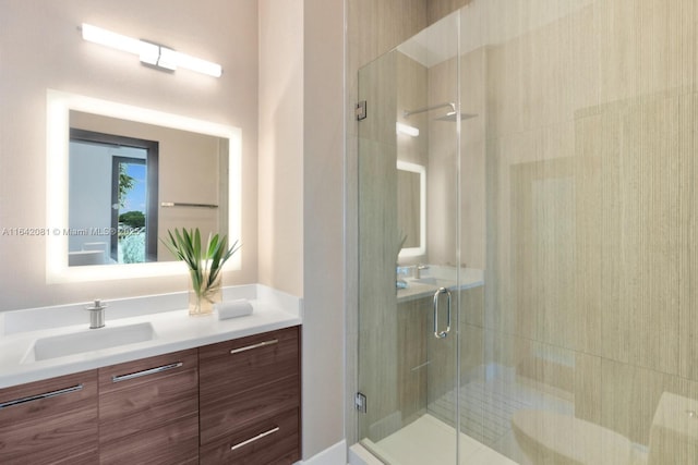 bathroom with vanity and walk in shower