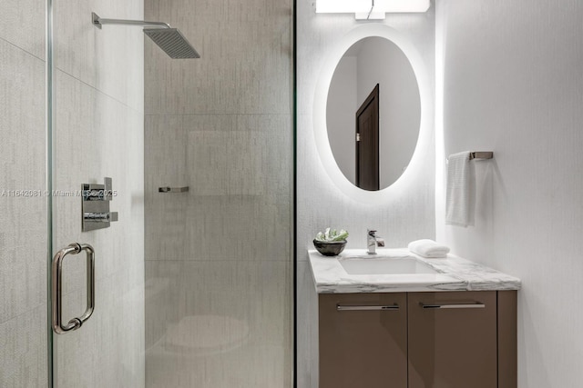 bathroom with vanity and an enclosed shower