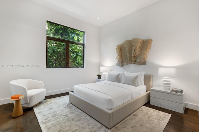 bedroom featuring dark wood-type flooring