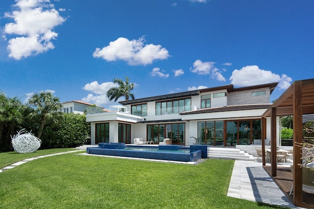 back of house featuring a patio area and a yard