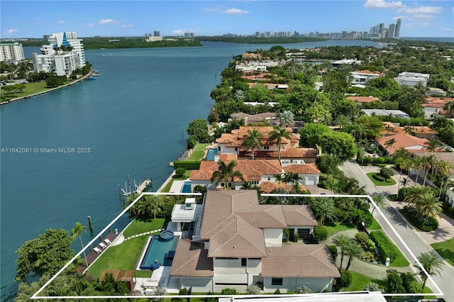 birds eye view of property featuring a water view