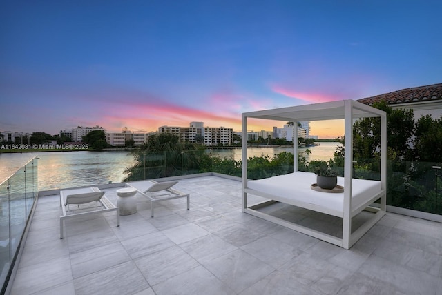 patio terrace at dusk with a water view