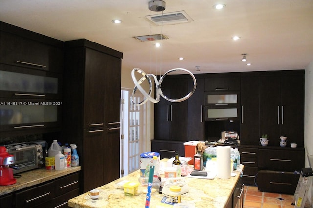 kitchen featuring light stone counters