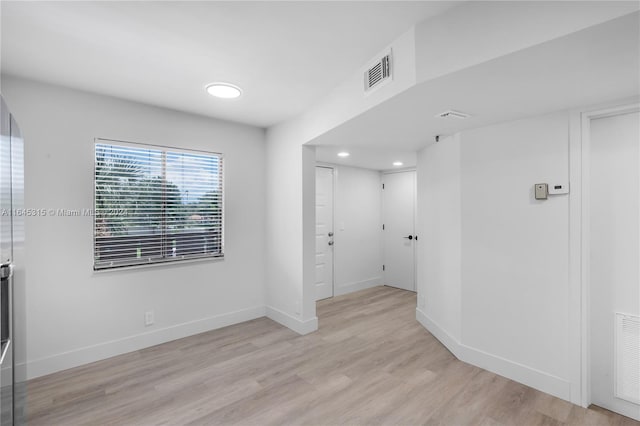 empty room with light wood-type flooring