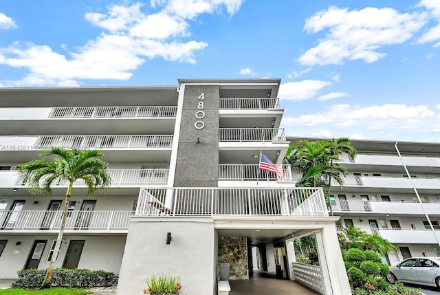 4800 Hillcrest Ln Unit 210, Hollywood, FL 33021 - view of apartment building / complex with a carport