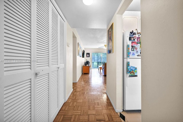 hallway with parquet flooring