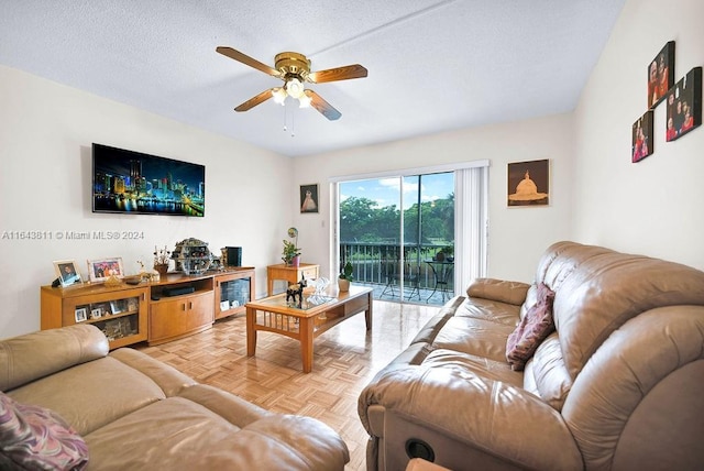 4800 Hillcrest Ln Unit 210, Hollywood, FL 33021 - living area featuring a ceiling fan and a textured ceiling