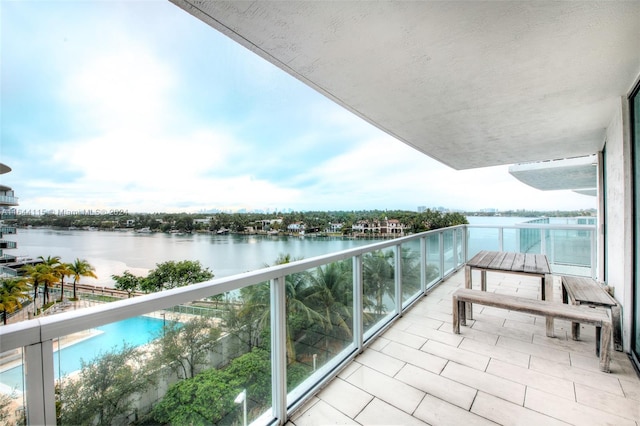 balcony featuring a water view