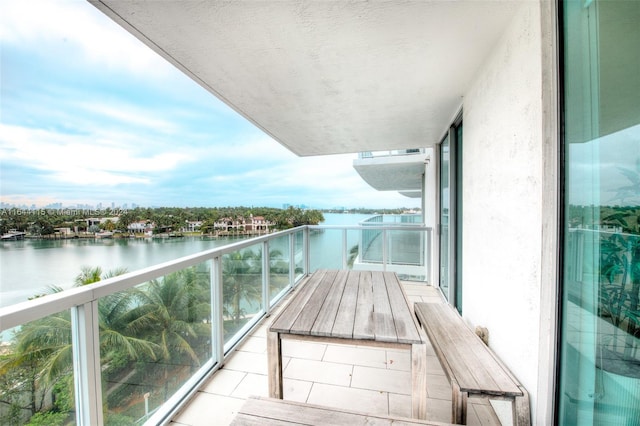 balcony featuring a water view