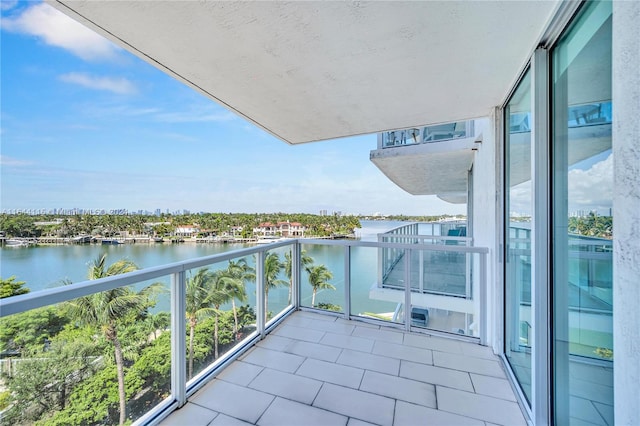 balcony featuring a water view