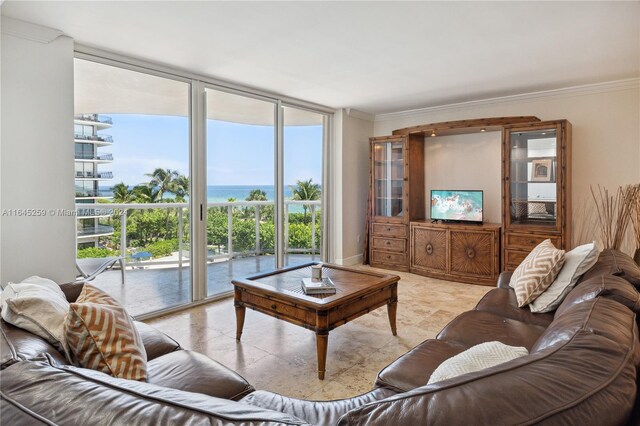 living room featuring ornamental molding, floor to ceiling windows, and light tile patterned floors