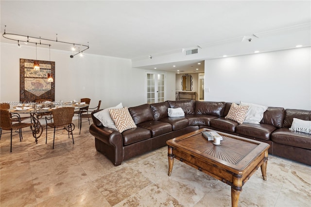 living room with crown molding, light tile patterned floors, and rail lighting