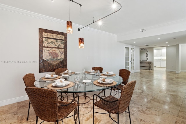 dining space with crown molding, light tile patterned floors, track lighting, and french doors