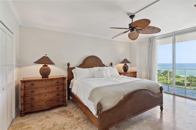 bedroom featuring a water view, access to exterior, light tile patterned floors, a closet, and ceiling fan