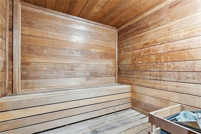 view of sauna / steam room featuring wooden walls