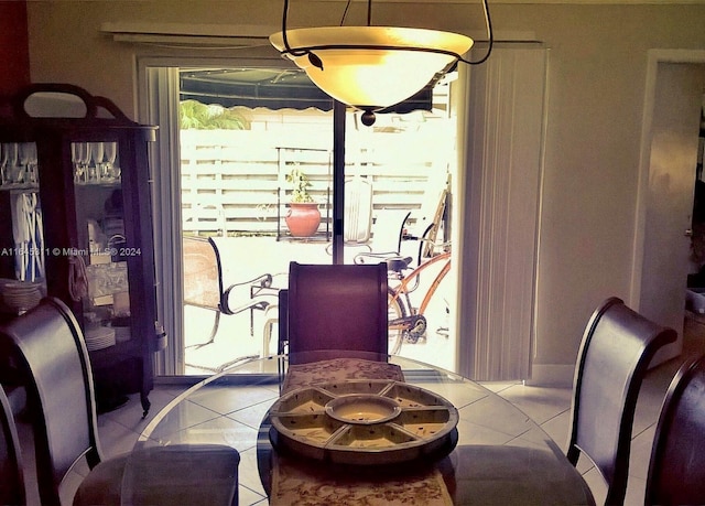 dining space with tile patterned flooring