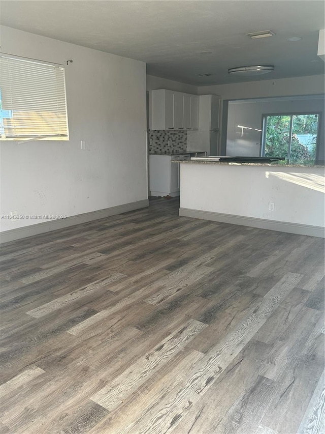 kitchen with white cabinets and dark hardwood / wood-style flooring