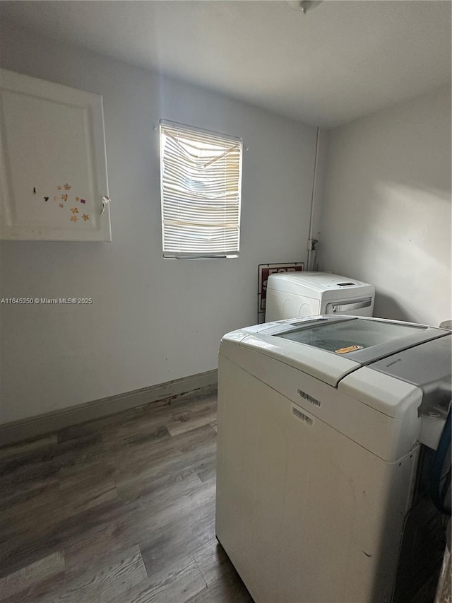 laundry area with hardwood / wood-style floors and separate washer and dryer