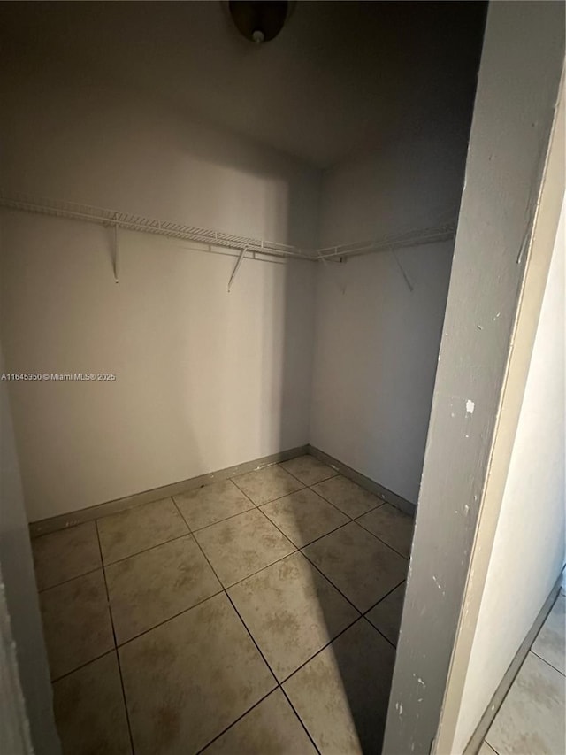 walk in closet featuring light tile patterned floors