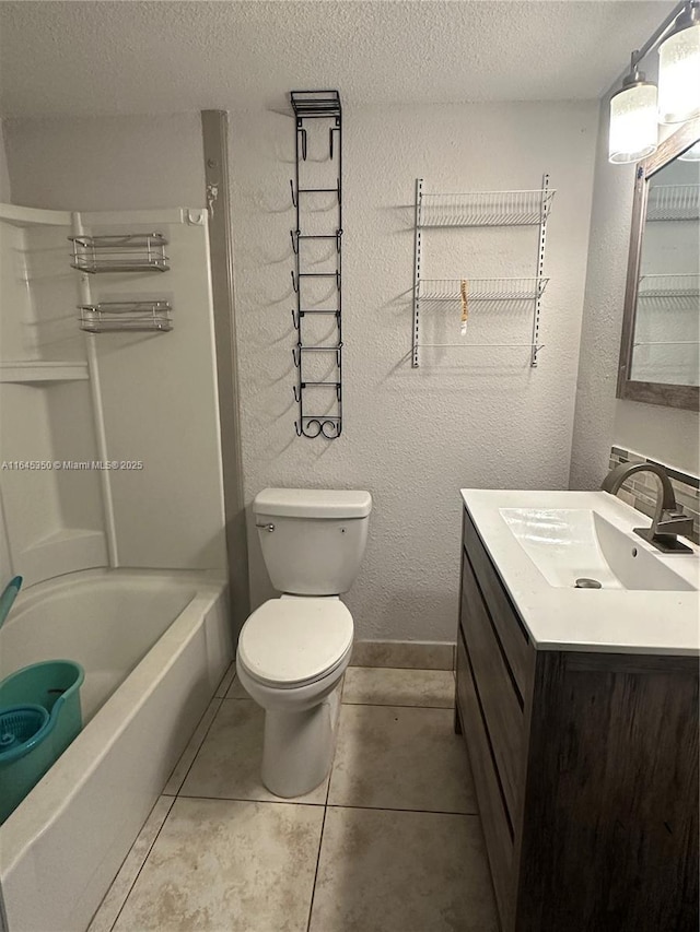 full bathroom with tile patterned floors, bathing tub / shower combination, a textured ceiling, toilet, and vanity