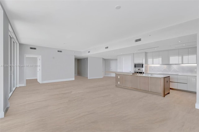 interior space featuring sink and light tile patterned flooring