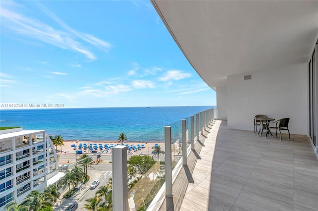 balcony featuring a water view