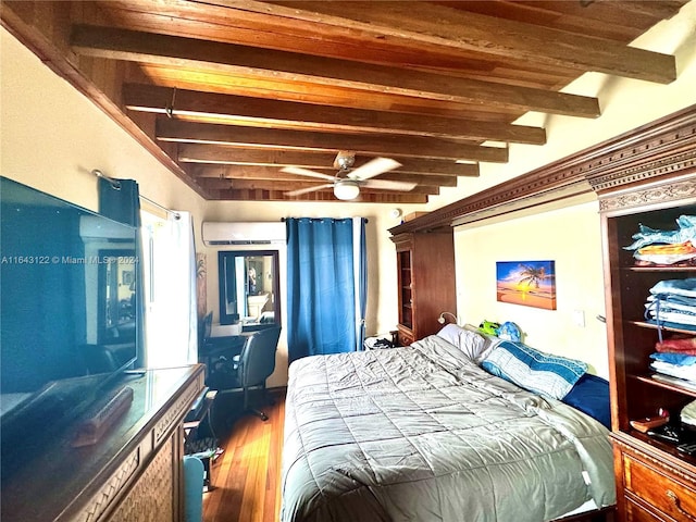 bedroom featuring beam ceiling, wooden ceiling, an AC wall unit, and wood finished floors