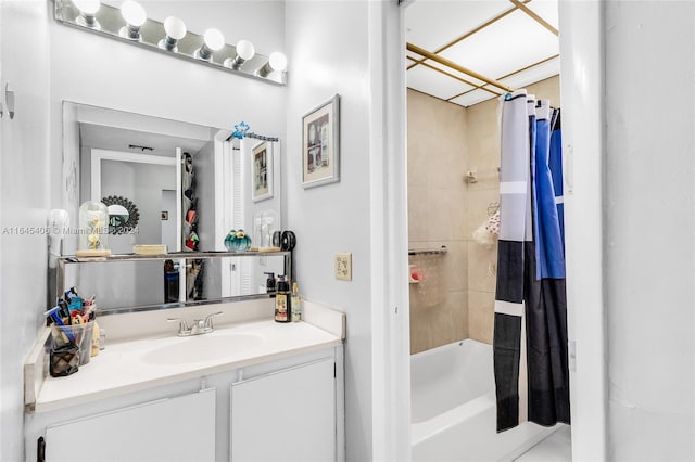 bathroom featuring vanity and shower / bath combination with curtain