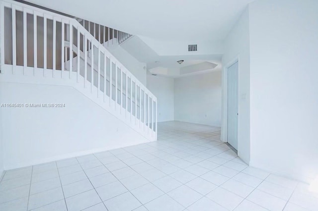 stairs with tile patterned flooring and visible vents