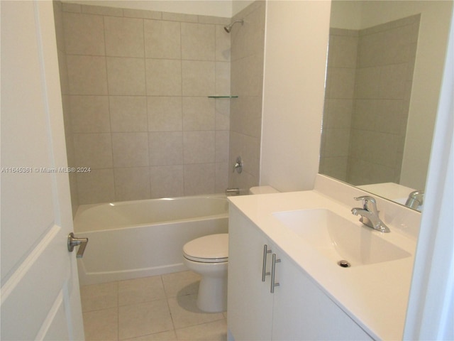 full bathroom featuring tiled shower / bath, toilet, tile patterned floors, and vanity