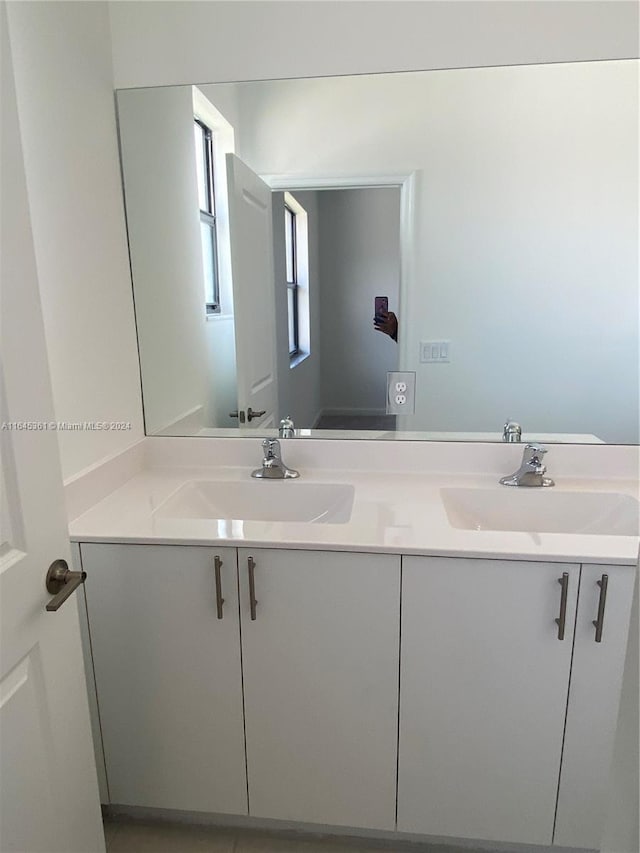 bathroom with dual vanity