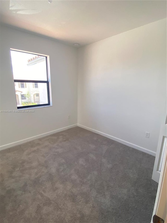 empty room with carpet flooring