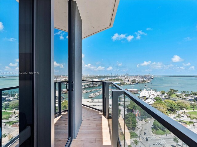 balcony featuring a water view