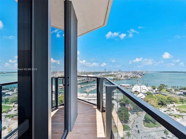 balcony featuring a water view