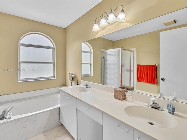 bathroom featuring tile patterned flooring, vanity, and plus walk in shower