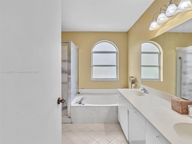 bathroom featuring tile patterned floors, vanity, and independent shower and bath