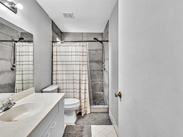 bathroom featuring tile patterned flooring, vanity, toilet, and a shower with shower curtain