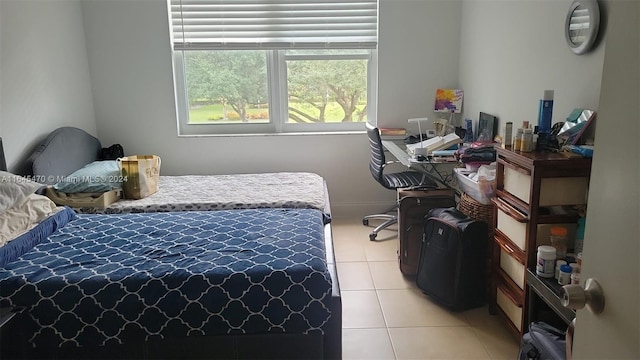 bedroom featuring light tile patterned flooring