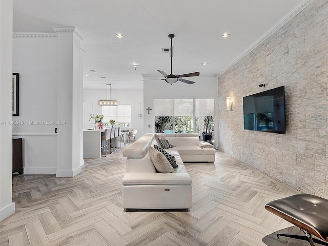 living room featuring crown molding, recessed lighting, visible vents, and baseboards