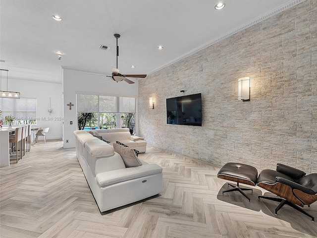 living room featuring visible vents, recessed lighting, and ornamental molding