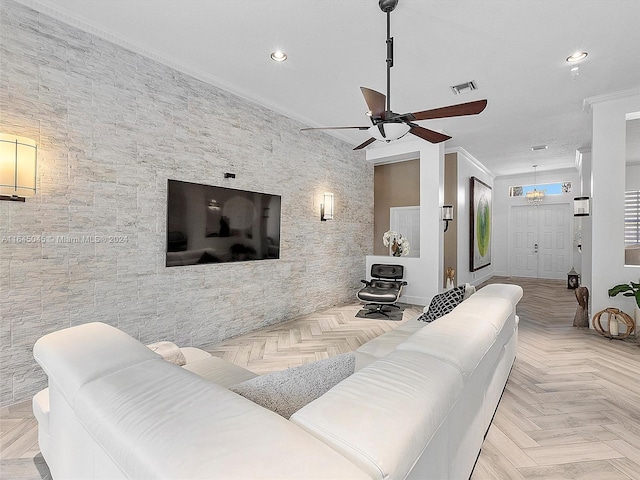 living room with ceiling fan, ornamental molding, and light parquet floors