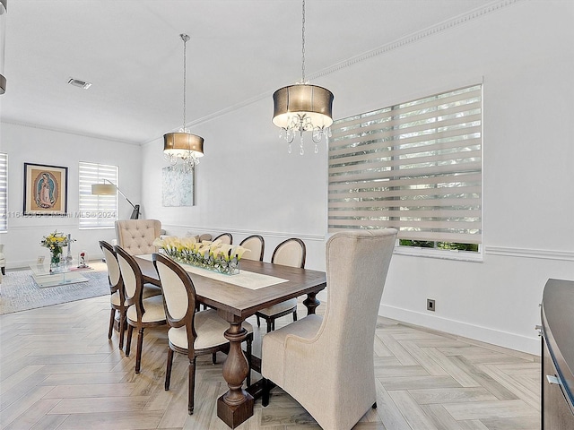 dining area with visible vents, crown molding, and baseboards